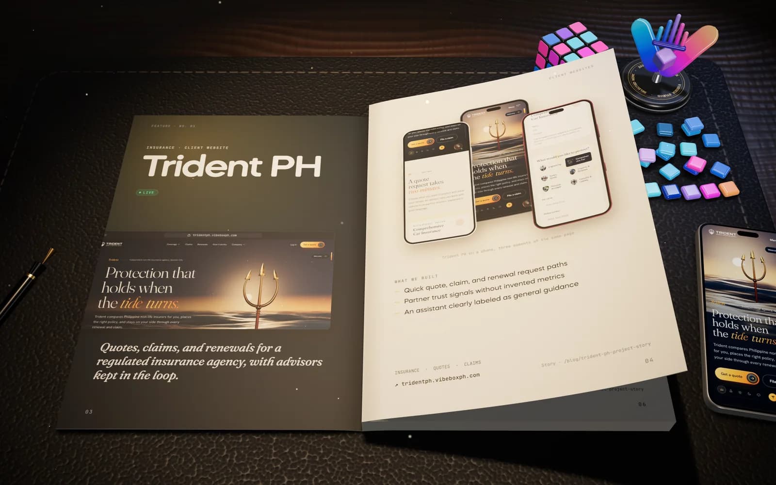 The VibeBox studio brochure open on a desk under a lamp, a page lifting at its corner